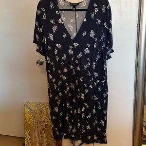 Short rompers in a size 18/20, dark blue with flower print.